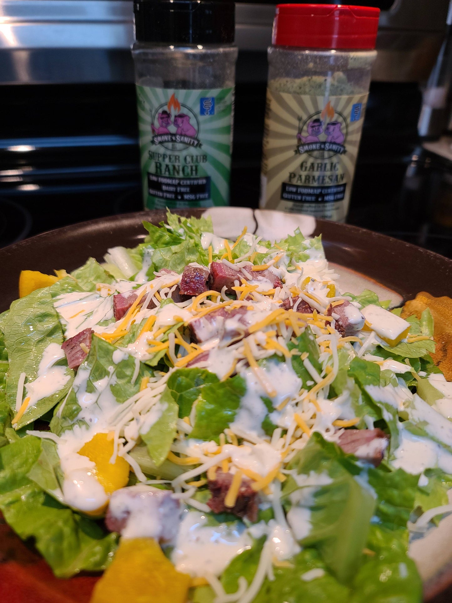 Salad topped with garlic parmesan ranch salad dressing