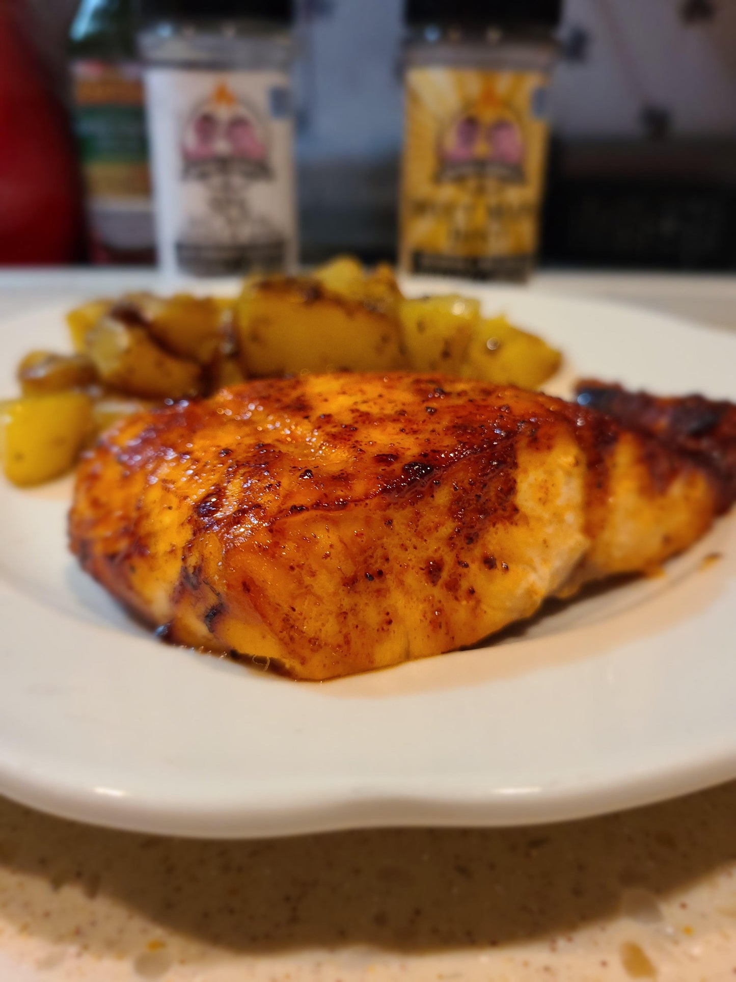 Plate with air fried salmon and grilled potatoes