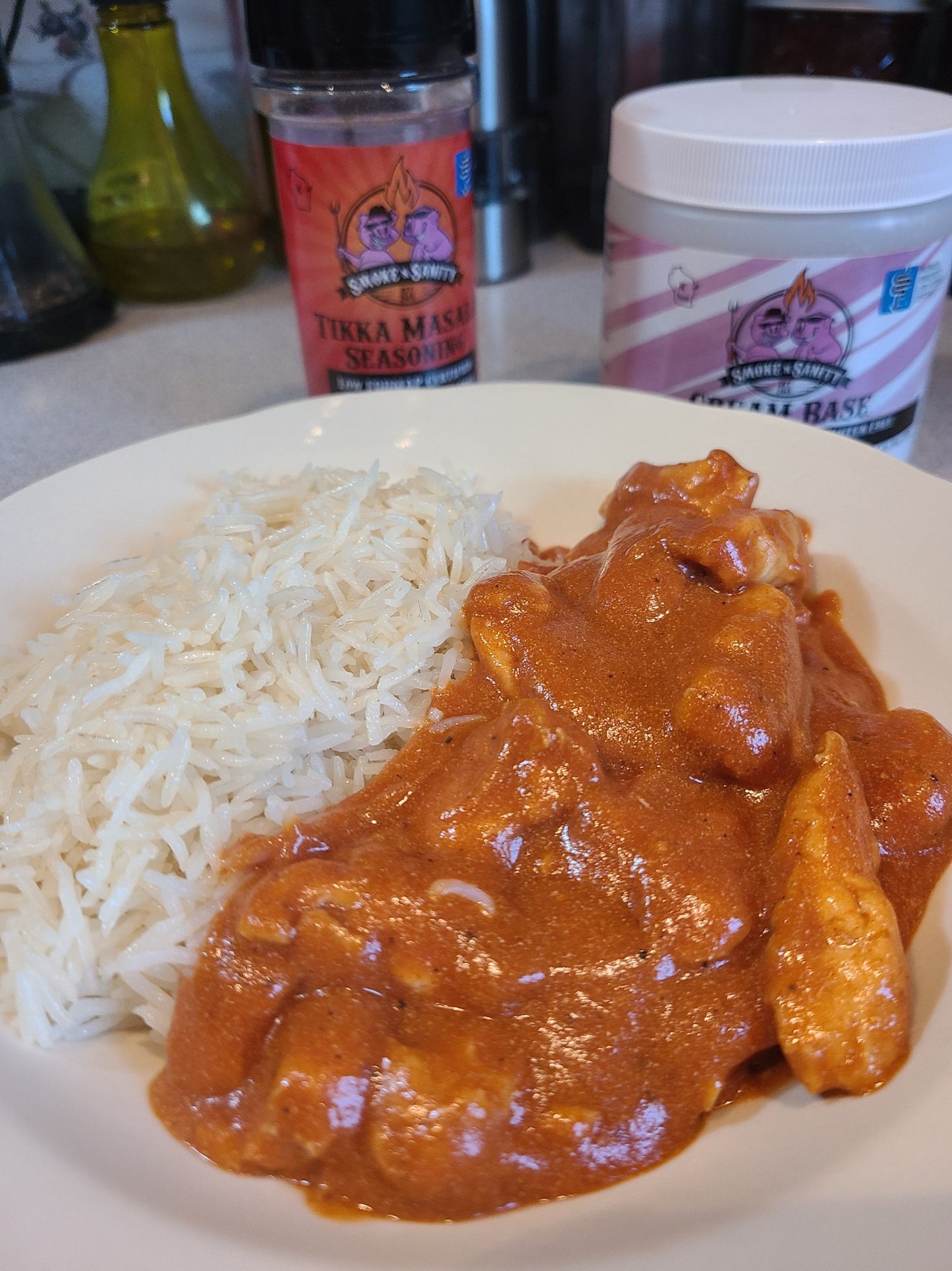 Place of chicken tikka masala with a side of rice
