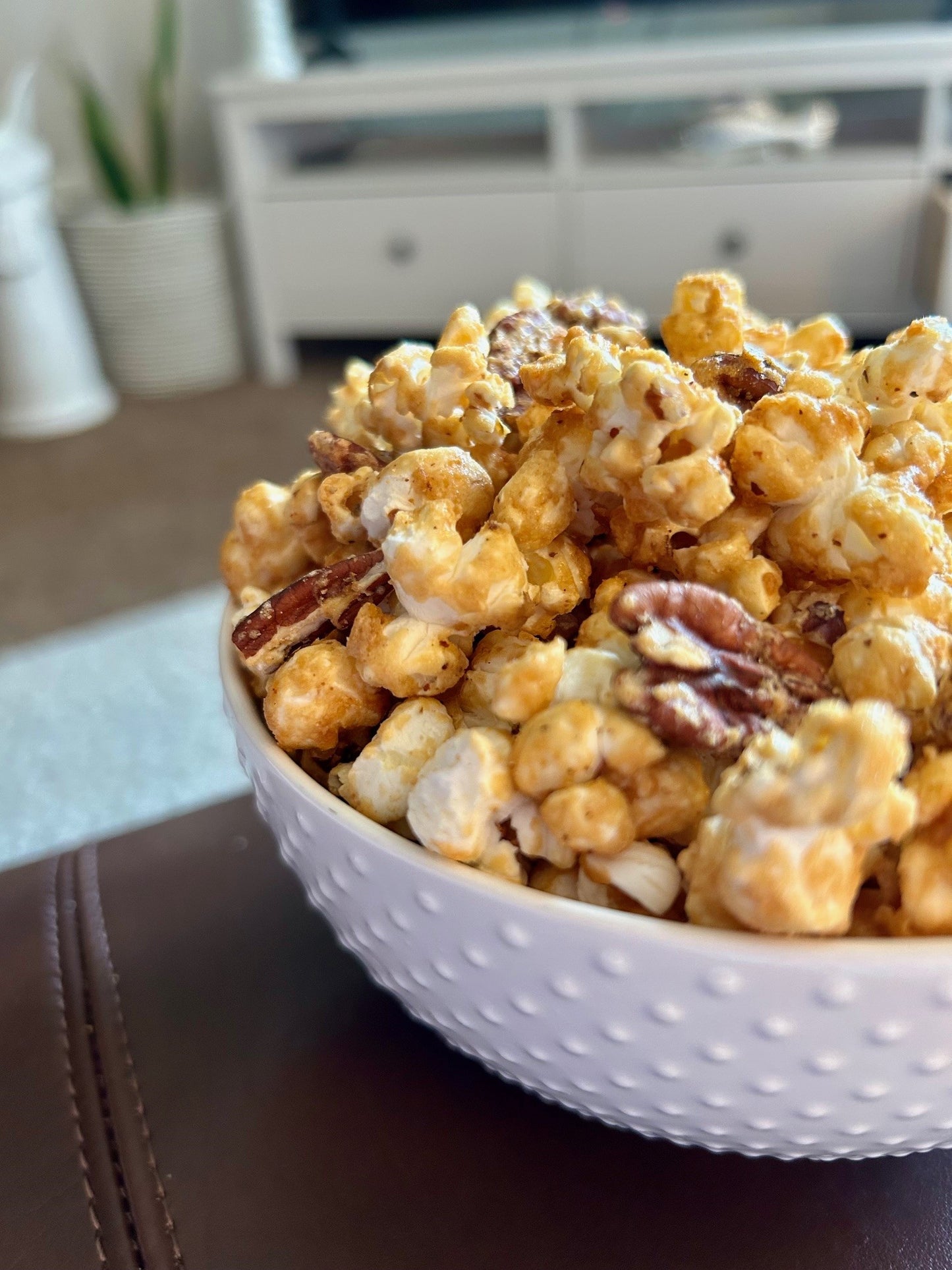 Maple dusted butter pecan popcorn in a bowl