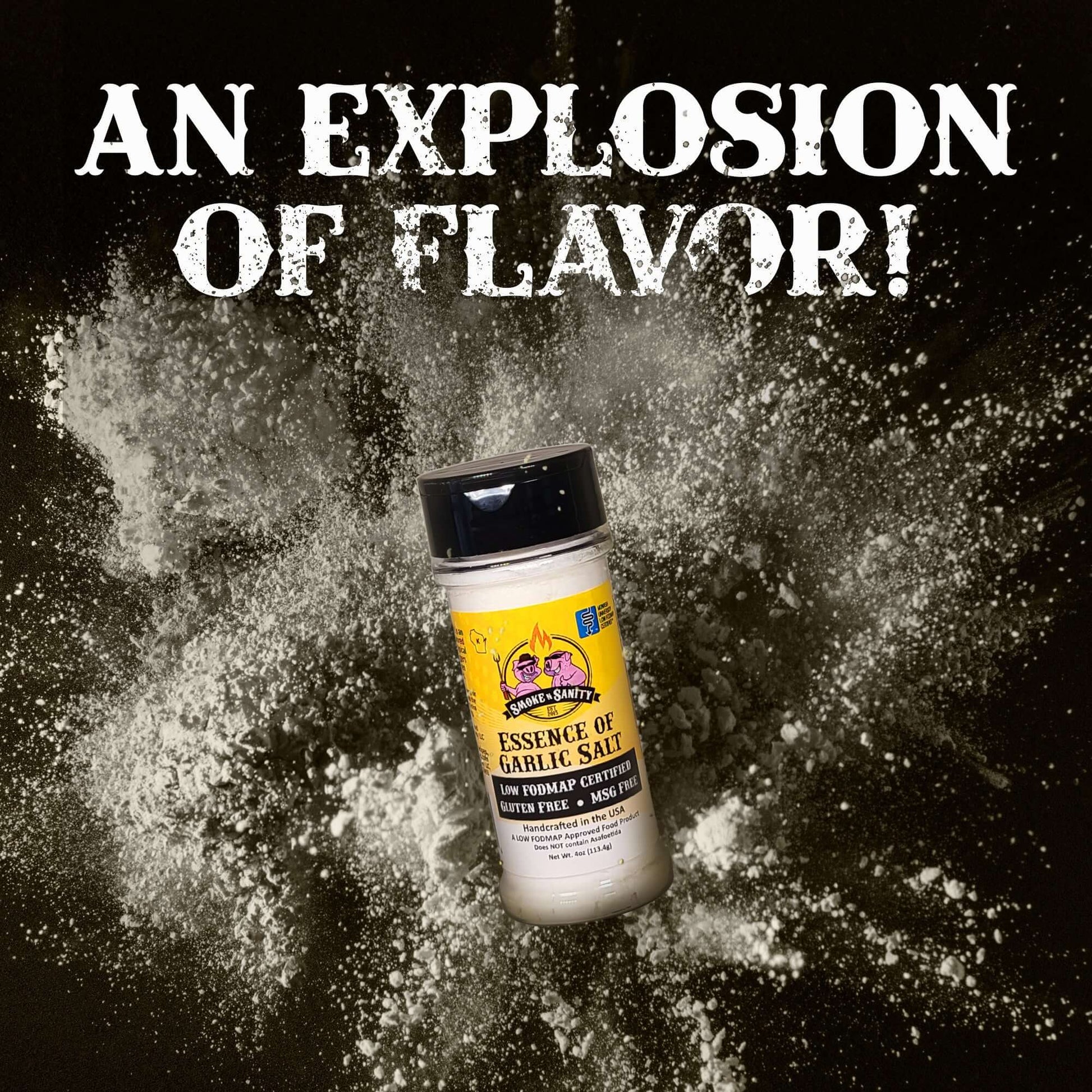 An explosion of flavor.  Bottle of Essence of Garlic Salt with seasoning exploding around the bottle.