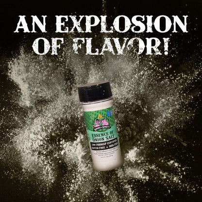 An explosion of flavor.  Bottle of Essence of Onion Salt with seasoning exploding behind it.