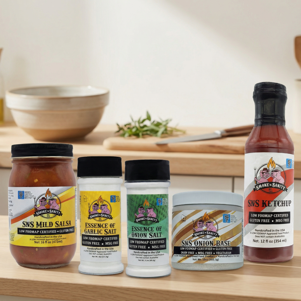 Collection of S n S Ketchup and related products on a wooden surface with a neutral background.